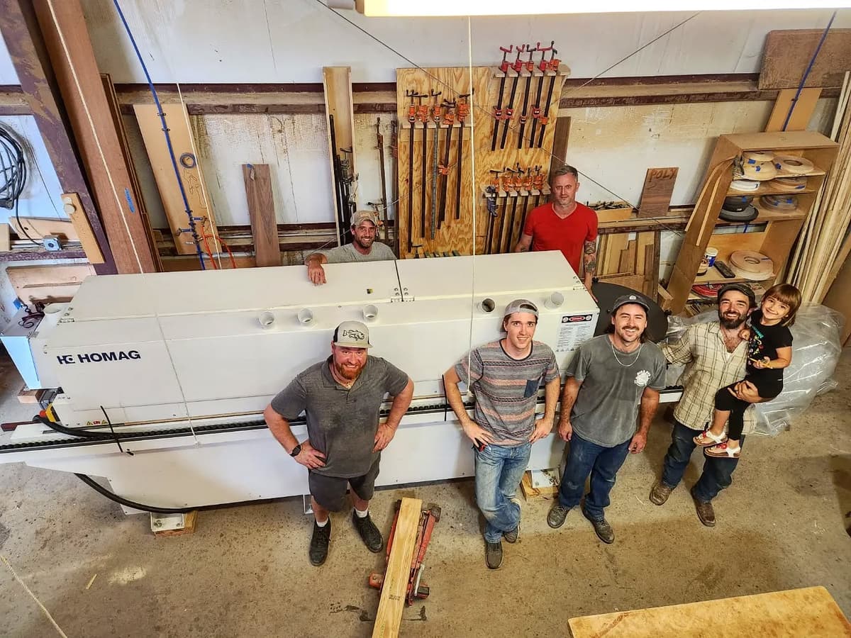 The CMCC Workshop Family - Six craftsmen and next-generation apprentices around their precision CNC machinery in Spicewood, Texas