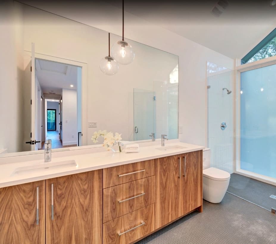 Modern Walnut Bathroom Elegance - European frameless cabinets in Austin, TX